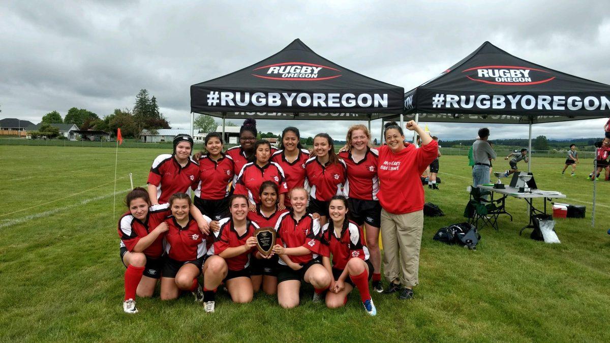 Franklin’s rugby team poses with a trophy during last season's spring championships.  Photo by Kya Bailey.