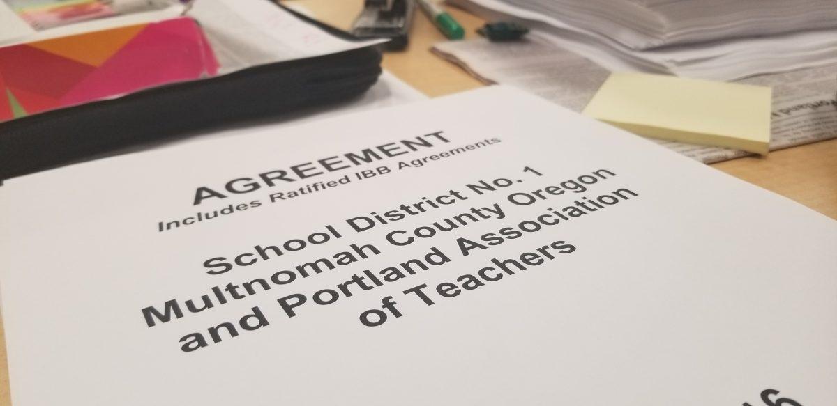 A copy of the teacher contract containing a full 108 pages. The contract has been outdated for two years, and PAT is considering a strike. Photo by Jackson Hartigan