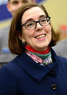 Oregon’s Governor, Kate Brown, both proposed and signed House Bill 4145 into law. The measure will restrict any “intimate partner” who has been convicted of domestic violence or stalking from purchasing a gun. Photo By Oregon National Guard from Salem, Oregon, United States (170309-Z-OT568-169) [Public domain], via Wikimedia Commons