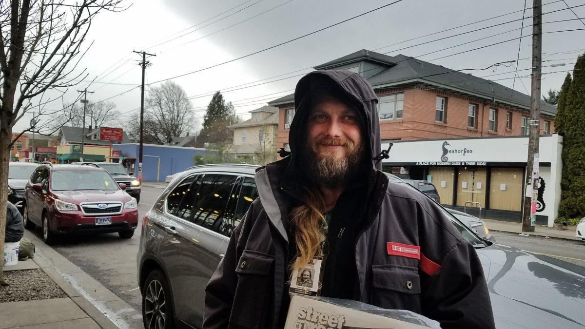 Jeremiah sells Street Roots newspapers on Southeast Hawthorne Blvd. Due to rising housing prices in Portland, he has been on and off homeless for fourteen years. Photo by Nathan Wilk.