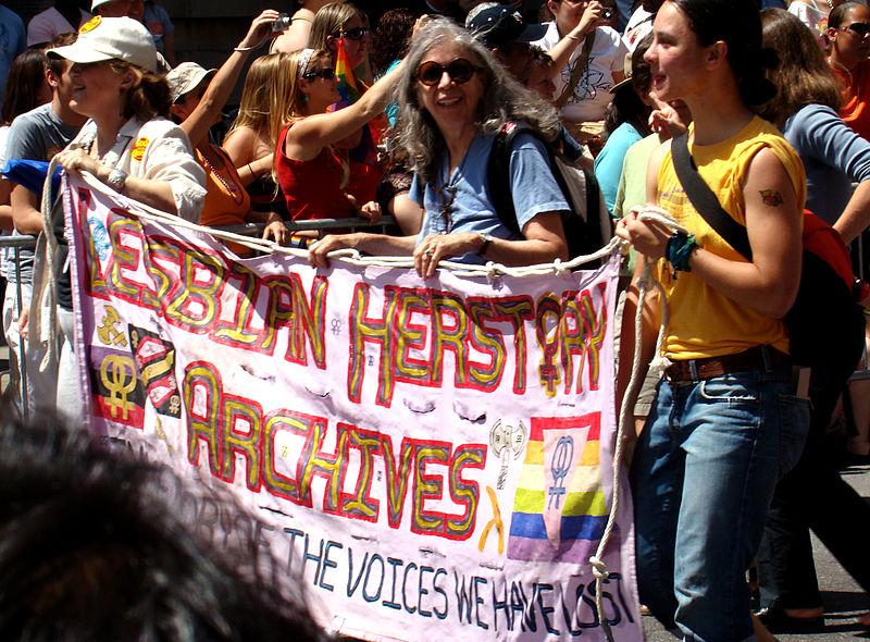 A group of women display a banner reading “Lesbian Herstory Archives” at a 2007 LGBT pride march in New York City. Photo via Wikimedia Commons.