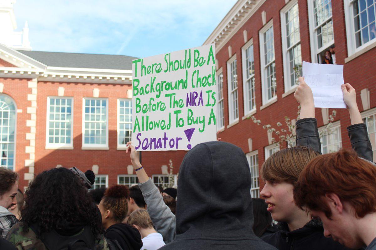 Franklin students hold up signs at walkout. Many politicians cite mental illness as the root of gun violence. Photo by Sydney George.