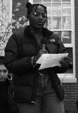 Marceline Kilassa (12) speaks at the March 14 student gun control rally at Franklin High School. Kilassa is an involved student activist. Photo by Sydney George.