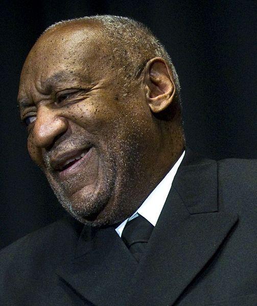 Bill Cosby during a pinning ceremony at US Navy Memorial February 17, 2011, in Washington D.C. These honors were later revoked. Photo by Kevin S. O’Brien via wikicommons.