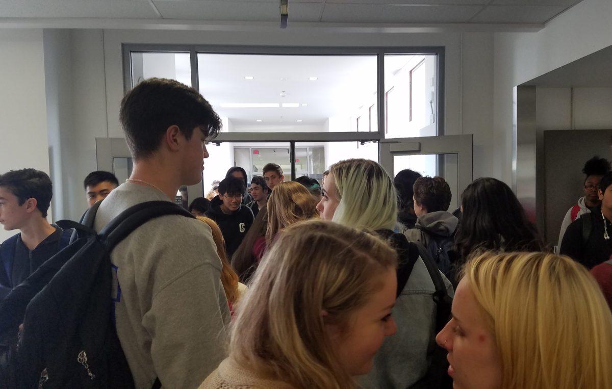 Students move through a flooded hallway. Franklin’s 1700 maximum building is now having to support over 1800. Photo by Nathan Wilk.