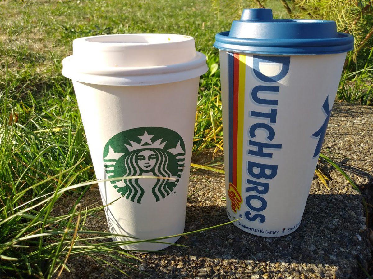 A Pumpkin Spice Latte from each of the two most well-known coffee houses in Oregon, Starbucks and Dutch Brothers sit side by side. Photo credit: Leilani Vandehey