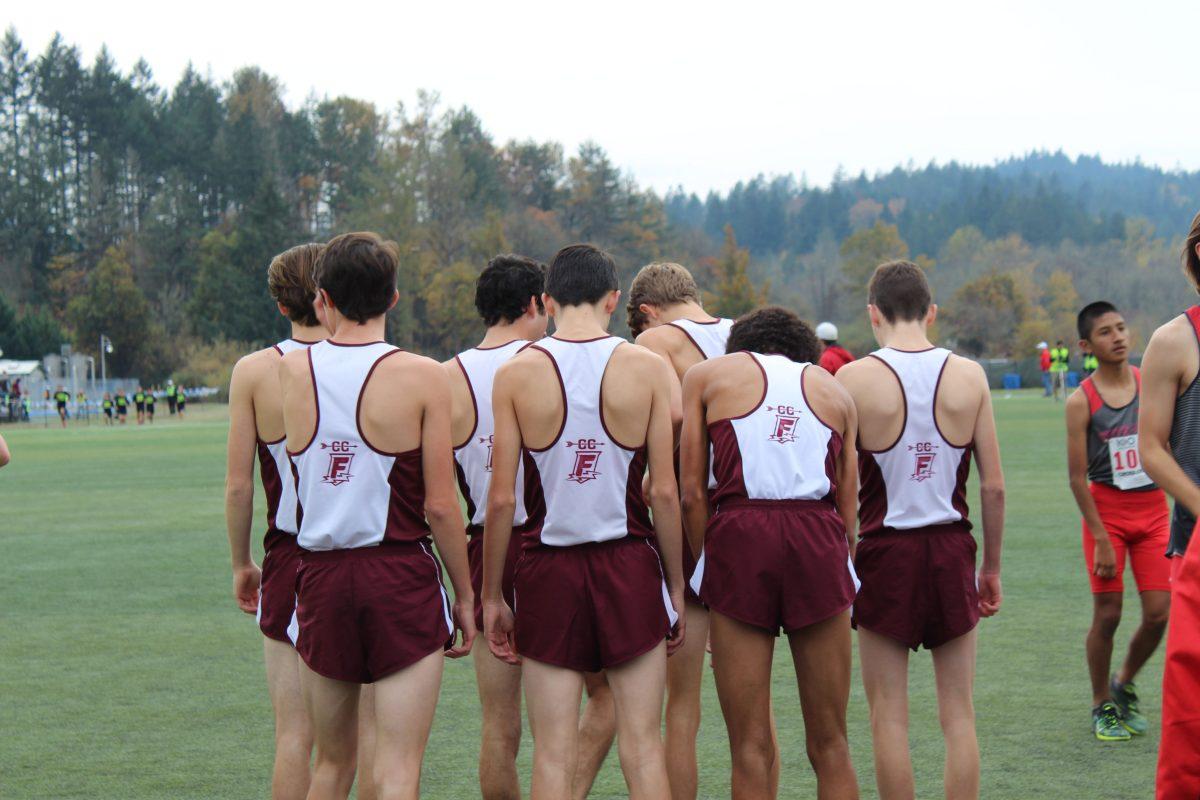 Franklin High School’s men’s cross country team gathers near the starting line just before lining up to run the fastest race in the Oregon state championship meet at Lane Community College on November 3, 2018. Photo taken by Lani Vandehey.