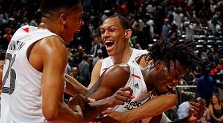 Darius Bazley (middle) celebrates with his teammates at the 2018 McDonald’s All American Game. A five star recruit, Bazley signed a $14 million  endorsement deal with New Balance in October, opting to forego college. Photo via Creative Commons.