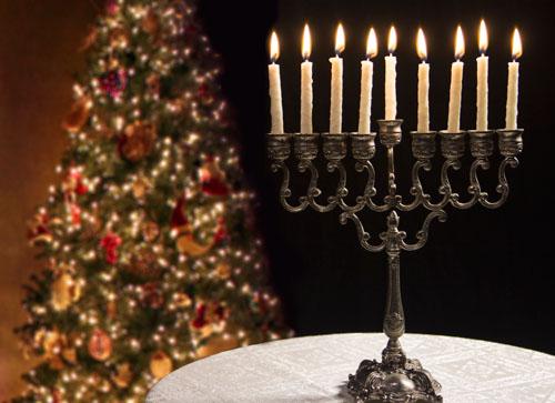 A Menorah, which is a main element of the Jewish holiday, Hanukkah; and a Christmas tree, which symbolizes life in the Christian religion. Photo credit to Religionnews.com.