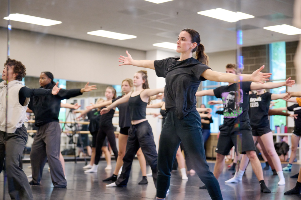 A reflection of the Franklin Dance room showing BODYTRAFFIC dancers in front of a crowd of Franklin students as they teach them choreography. Dance at Franklin recently partnered with White Bird and BODYTRAFFIC to provide this class. Photo by Leif Sjoquist.
