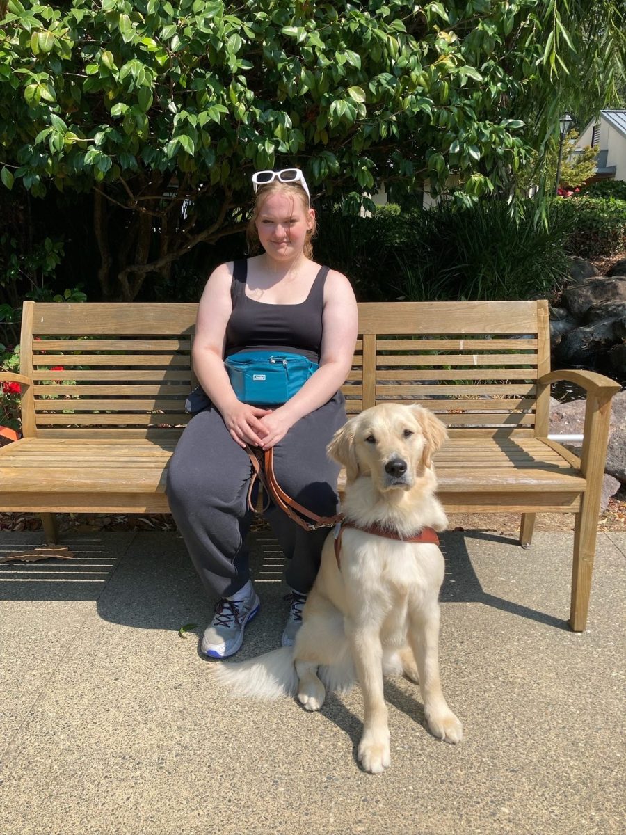 Franklin senior Sydney Hoeft and their guide dog, Major, during guide-dog training. Major now accompanies and assists them on a day-to-day basis, including navigating the Franklin halls and classrooms, showing one example of how service animals play a life-changing role in the lives of individuals with disabilities. Photo via Sydney Hoeft.