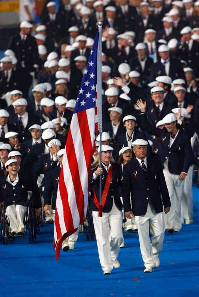 Jen Armbruster at the opening ceremony in the 2008 Beijing Paralympics carrying the flag for Team USA. This year's Paralympic games in Paris showed the strength and dedication of each of the American Paralympic athletes as they represented their state and hometown.  Photo via Jen Armbruster.