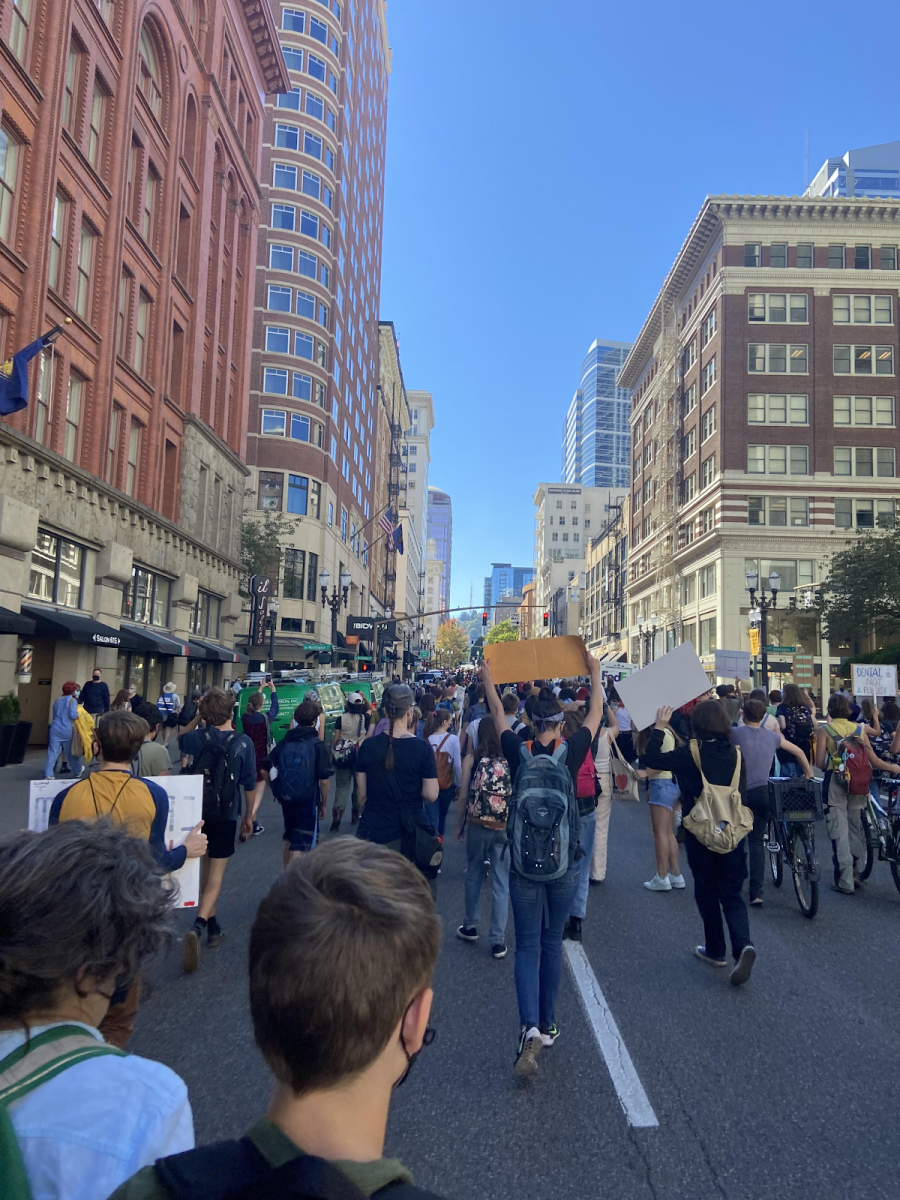 Portland youth unite downtown for a climate march in the summer of 2022. They protest through the streets, advocating and spreading awareness for climate justice. Photo by 