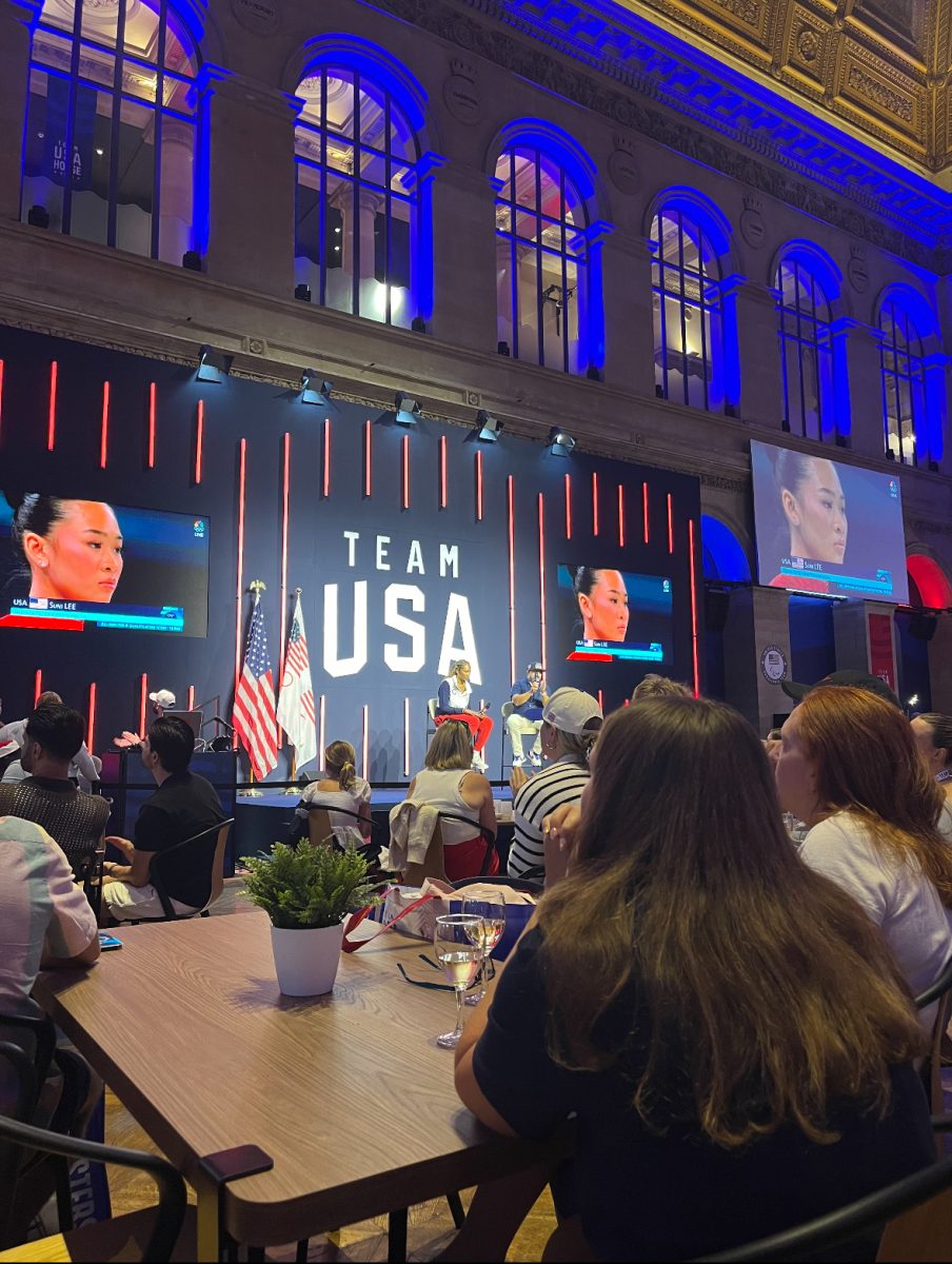 The Team USA House at the 2024 Paris Olympics watching American Gymnast Suni Lee compete. Some Americans who traveled to the Olympics viewed events like these at the USA Team House, enjoying watching a USA team full of not only incredible talent but also plenty of heartthrobs. Photo by Josephine Bourgault