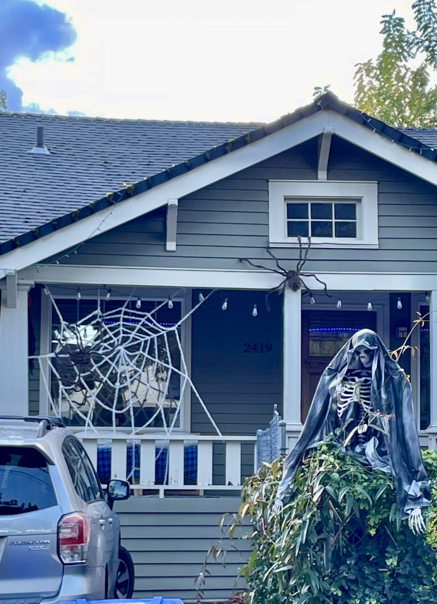 A house ready to receive trick-or-treaters, complete with decorations on theme for Halloween. Costumes come in all sizes: who will be knocking on this door on Oct. 31?  