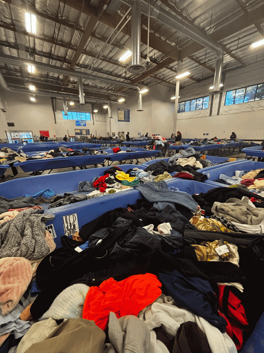 A tub overflowing with clothes at the Goodwill Bins. Every weekend many high school resellers search through these rotating bins all day to find items to list on Depop. Photo by Cedar Leeborg.