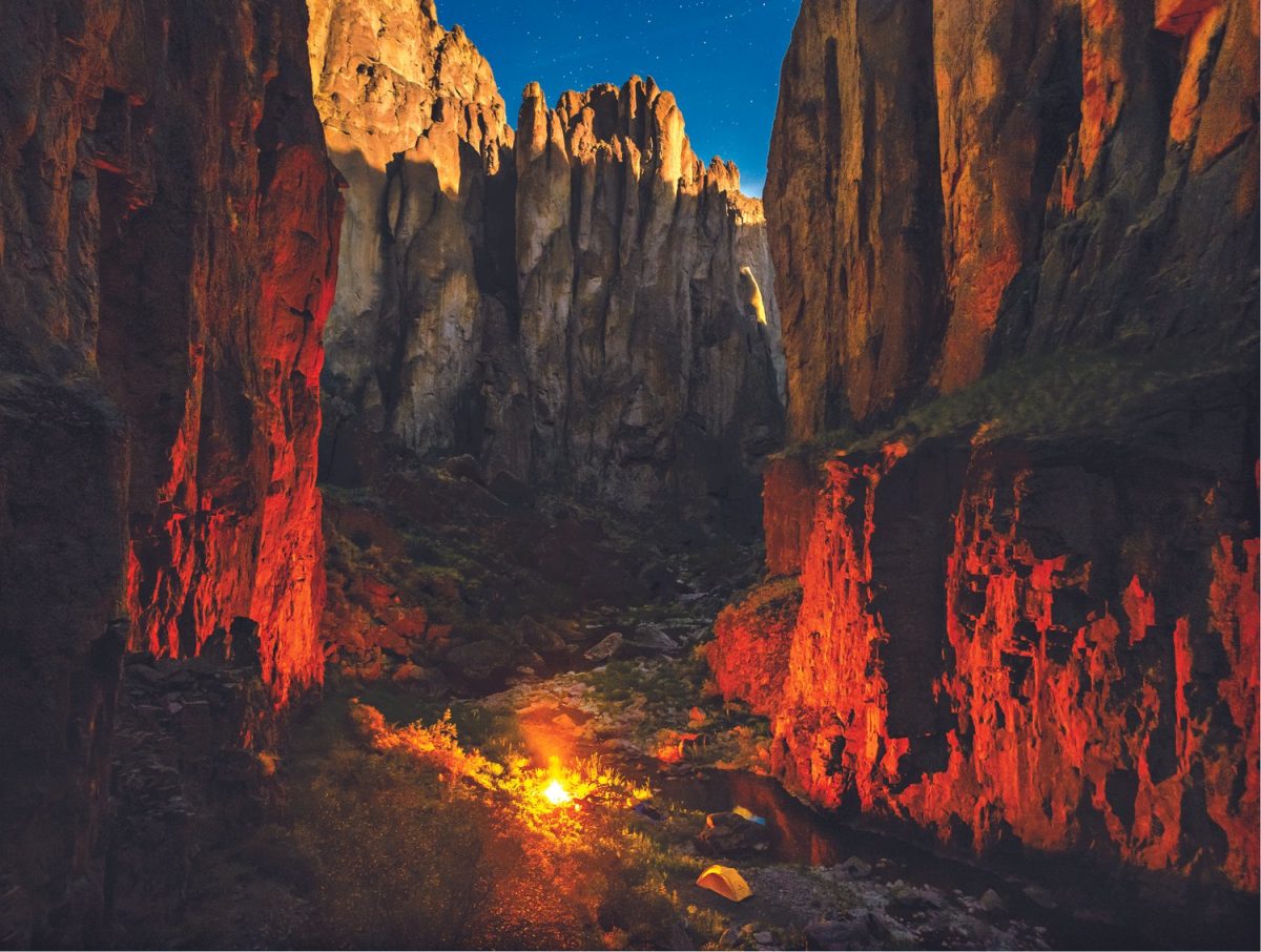 A campfire between two cliff sides in the Owyhee canyonlands in southeast Oregon. Local and federal attention has been turned towards protecting over a million acres of the region. Photo by J. Davis via Protect the Owyhee Canyonlands