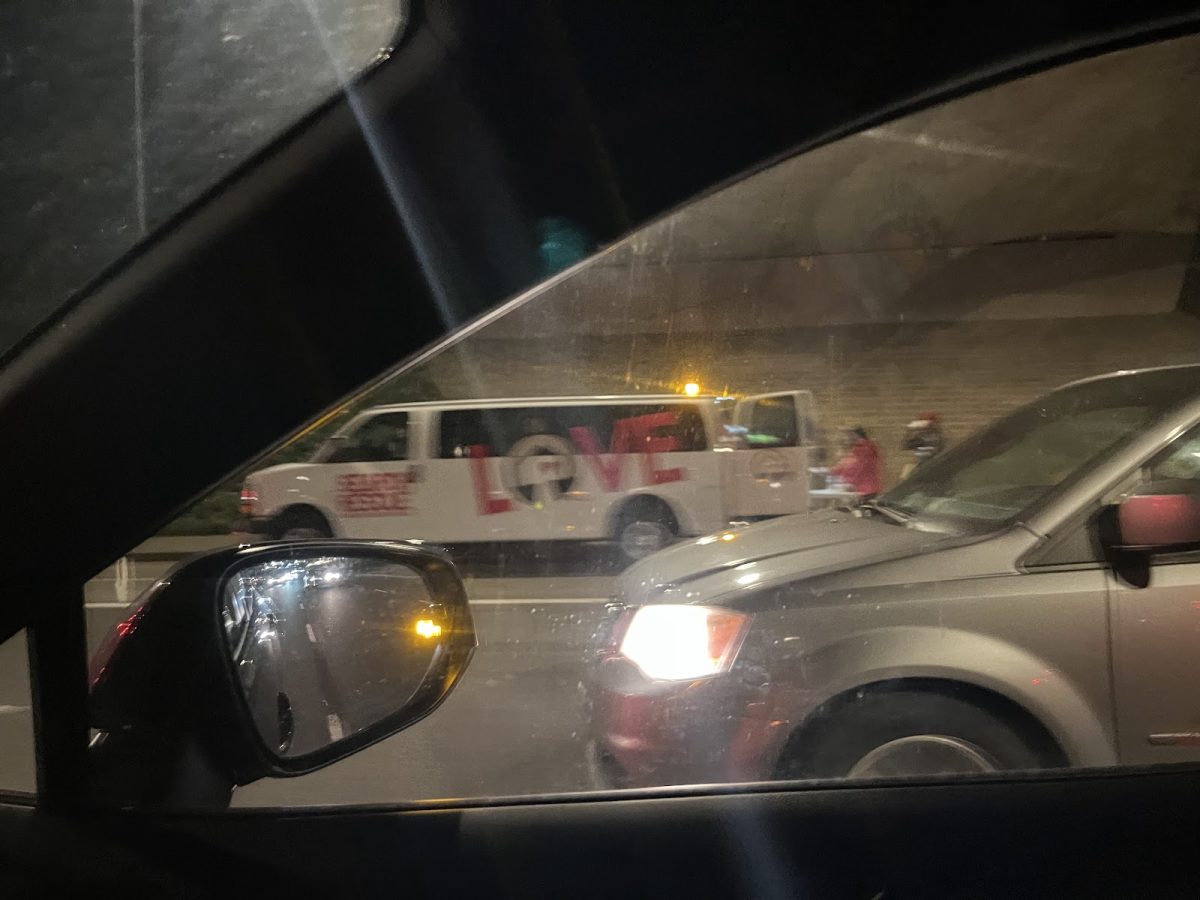 A Union Gospel Mission Search and Rescue van handing out supplies on the side of the I-205 highway. The vans frequently are found throughout PDX handing out resources to those in need.  Photo by 