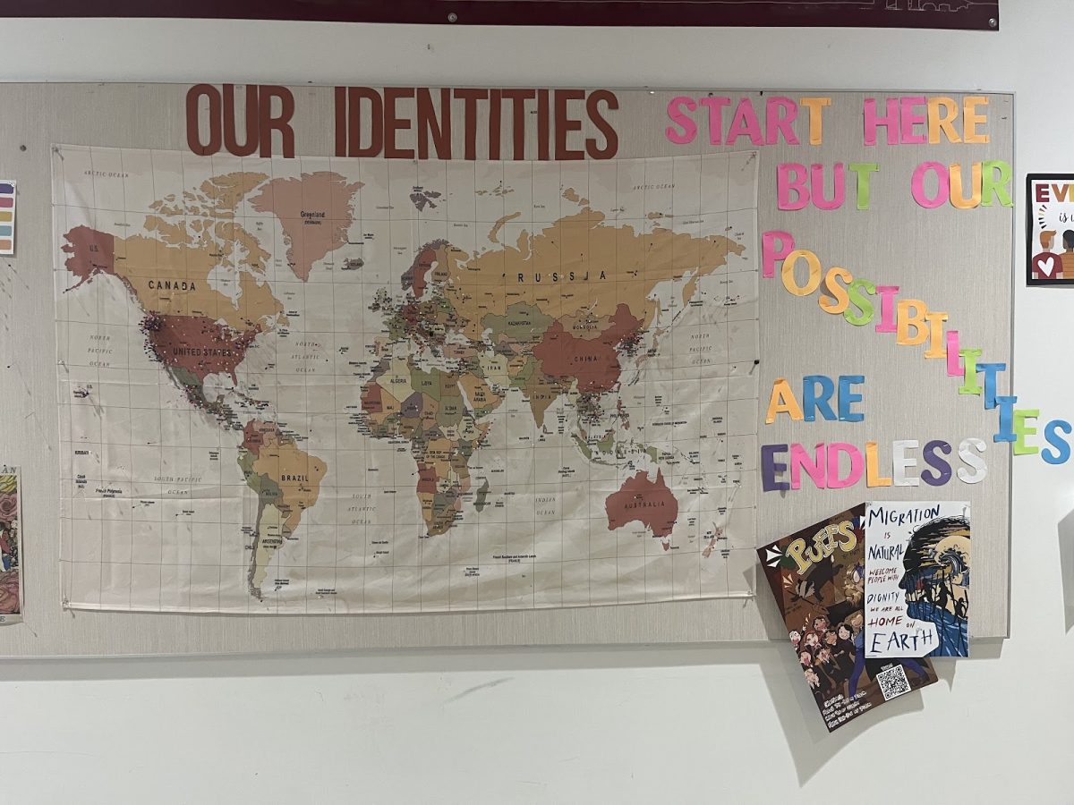 A world map in the Franklin main hallway scattered with pushpins, showcasing the many backgrounds that Franklin students come from. English Language Development (ELD) services in schools help support students of all backgrounds, cultures, and origins. Photo by 