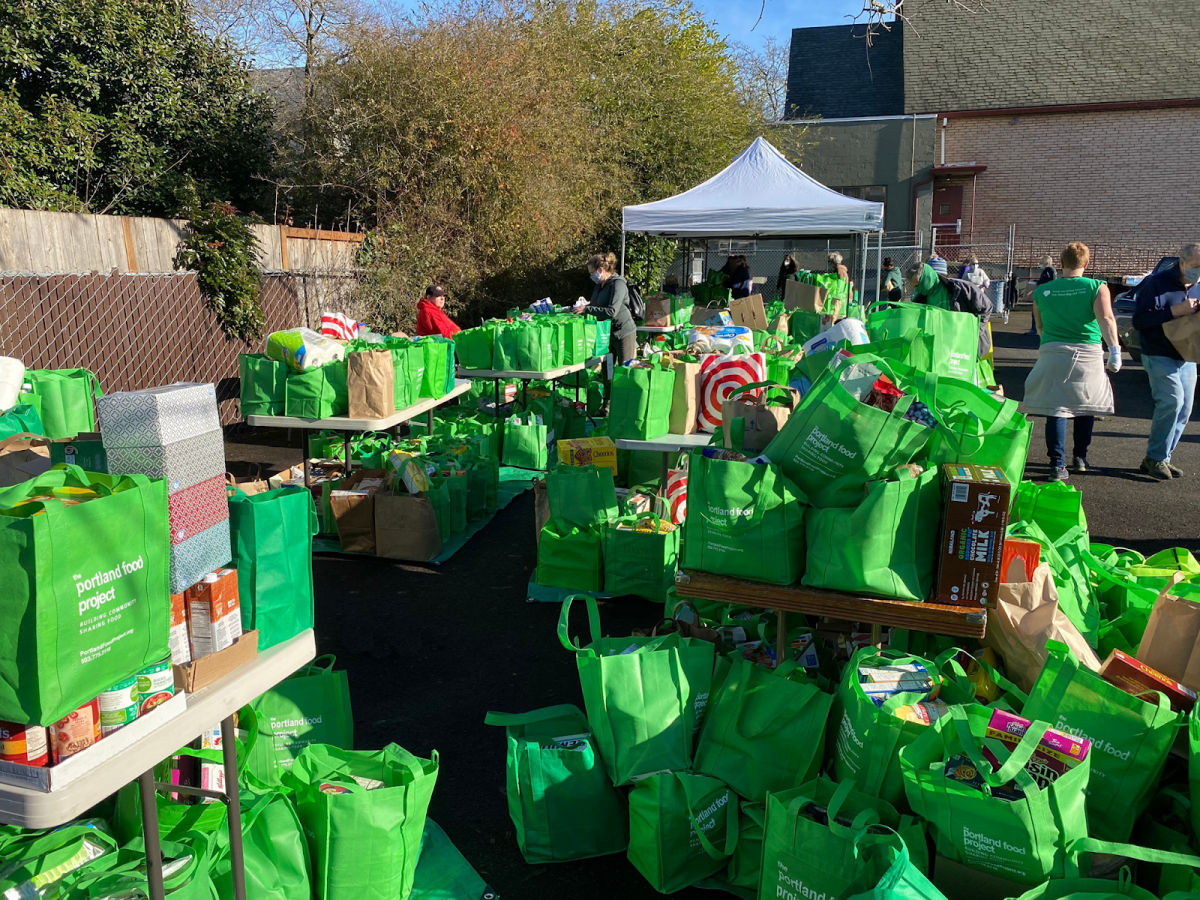 Food donations in Portland Food Project’s (PFP) signature green bags. Since 2012, PFP has supported local food pantries and collected over 1 million pounds of food. Photo via Portland Food Project.