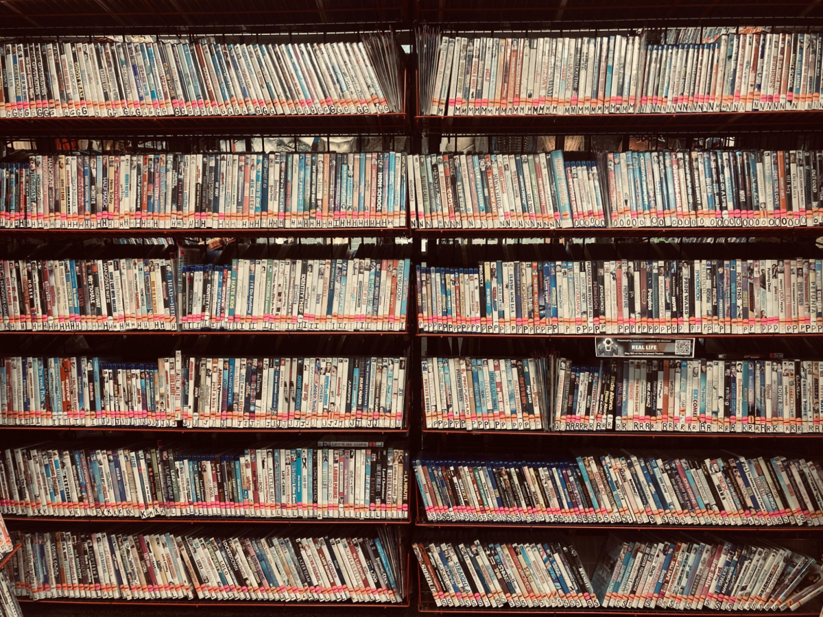 A shelf of movies at Movie Madness, a movie rental store in Portland. Film reviews balance subjective preference with objective analysis, so how do rating systems represent those factors? Photo by Charlotte Hanscom.