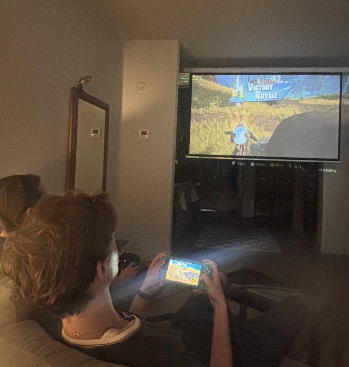 Two gamers gazing at the “victory royale” they achieved together in the Battle Royale game mode. Fortnite has allowed individuals to come together in the spirit of the game. Photo by 