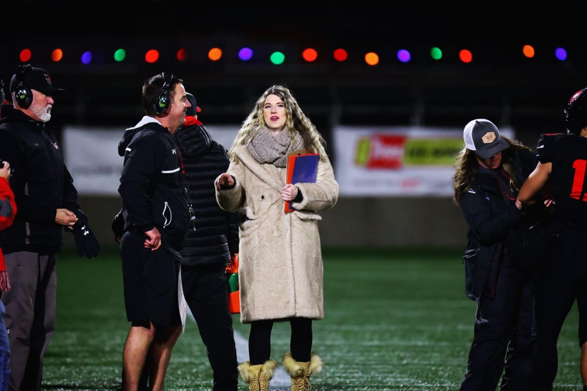 KOIN Sports Anchor Brenna Greene on the job. Greene, as a woman in sports media, has faced immense challenges. This is a common experience for women in sports, and the contributions they make need to be recognized. Photo via Brenna Greene. 