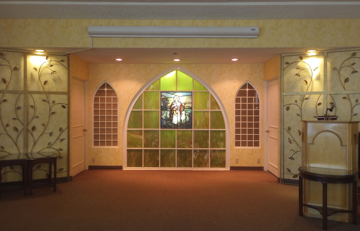 The lit service chapel at Mt. Scott Funeral Home. Mt. Scott Funeral Home is run by five funeral directors, offering various services such as funeral planning and grief resources. Photo by Finn Burton.