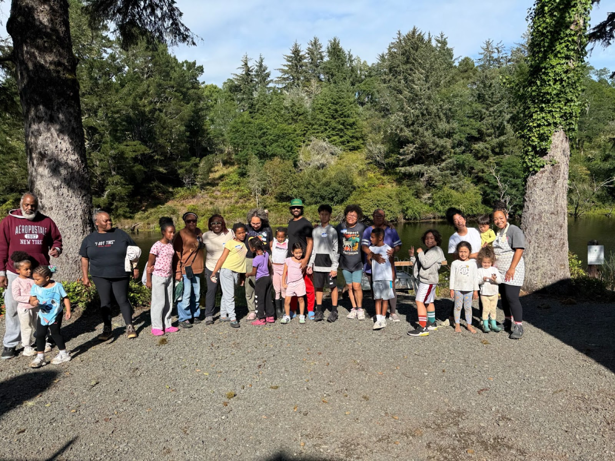 Members of People of Color Outdoors (POCO) posing for a photo after hiking, camping, and bird watching at Camp Kiwanilong. POCO is a nonprofit organization aimed at reducing the fear and intimidation that people of color can feel in outdoor spaces. Photo by Cleo Craig.