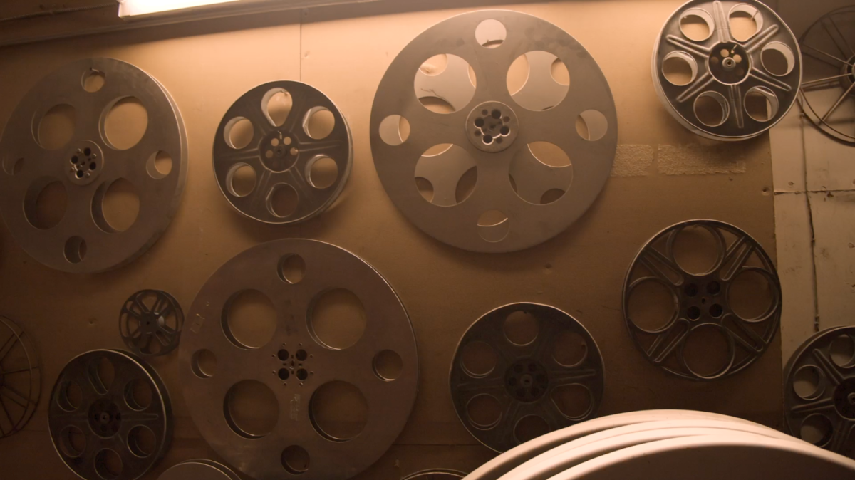 A wall full of cinema reels found behind the curtains of the Hollywood Theatre. These reels are used for projecting physical film onto a big screen. Photo By Francis Bolton