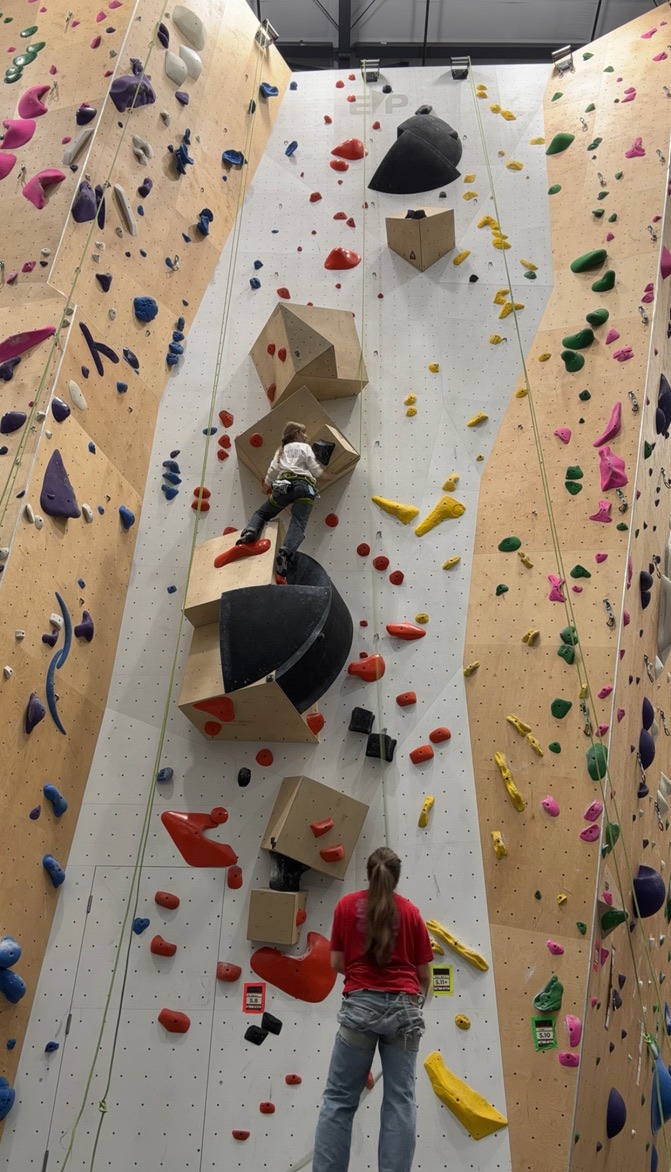 A climber and their belayer top rope climbing at Portland Rock Gym’s Beaverton location. Portland Rock Gym has a multitude of rock climbing types accessible to climbers in the Portland Metro Area. Photo by Isa Halle.