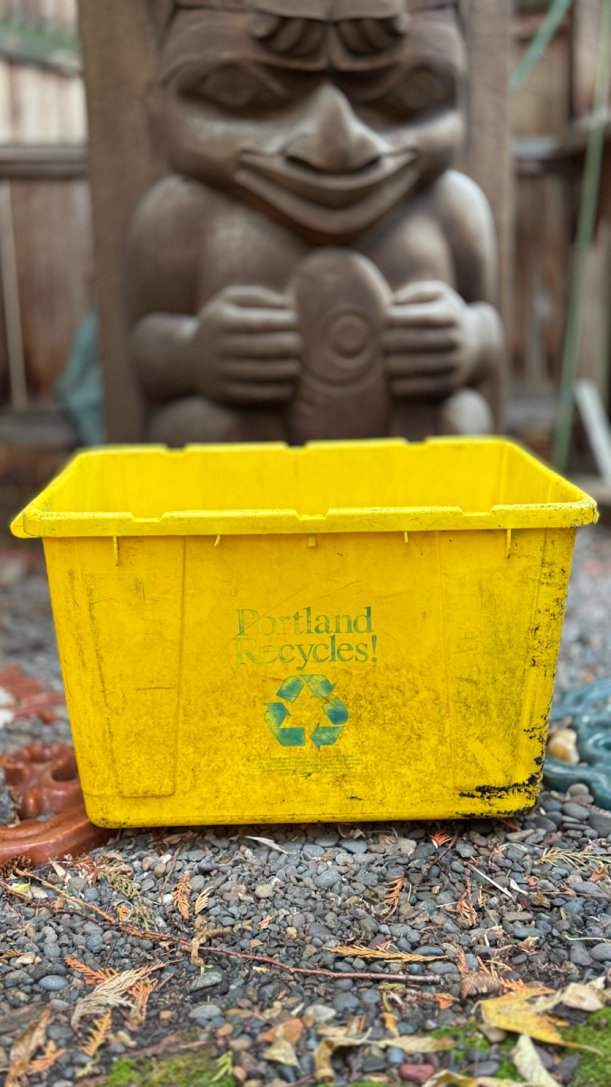 An old recycling bin sitting in the dirt. The Recycling Modernization Act hopes to create an improved recycling system in Oregon. Photo by Michael Halle.