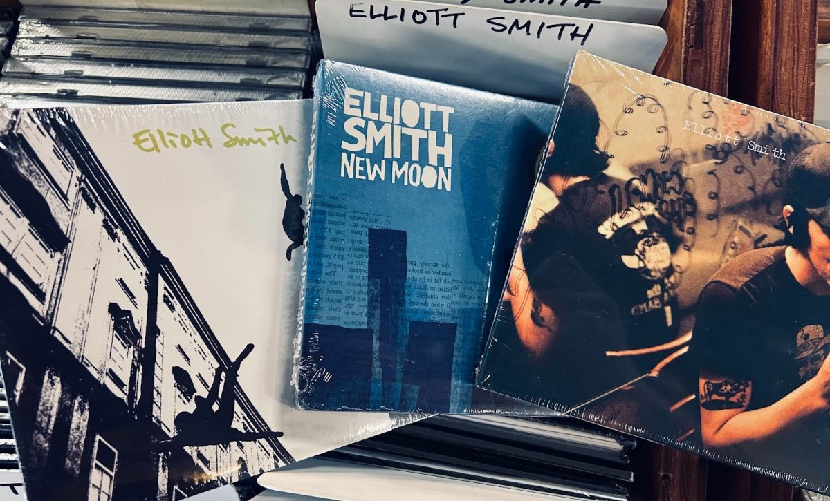 A collection of CDs of popular Elliott Smith albums, consisting of “Elliott Smith,” “New Moon,“ and “Either/Or.” Smith’s music impact has continued long past his death, especially on the people of Portland. Photo by Kai Blanchard-Ambrose