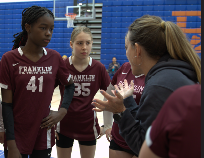 Denise Williams and Maiden Hayter getting game play advice from 7th grade Franklin Gray Youth Volleyball Coach, Teri Joseph. Franklin PIL Youth Sports has been a great introduction to a competitive environment and builds experience for young students. Photo by Eleanor Harper.