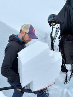 Dallas Glass, a forecaster for the Northwest Avalanche Centre (NWAC), performs a test to highlight the presence of strong and weak layers in the snowpack. Avalanche forecasters use numerous types of observations to assess how the snowpack changes over time. Photo via David Glass.