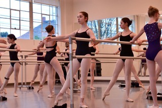Students in a ballet class at Northwest Dance Project. A typical ballet class consists of barre work, which is the warmup and foundation of all ballet technique, and center combinations that build off of what is learnt at the barre. Photo via Northwest Dance Project.