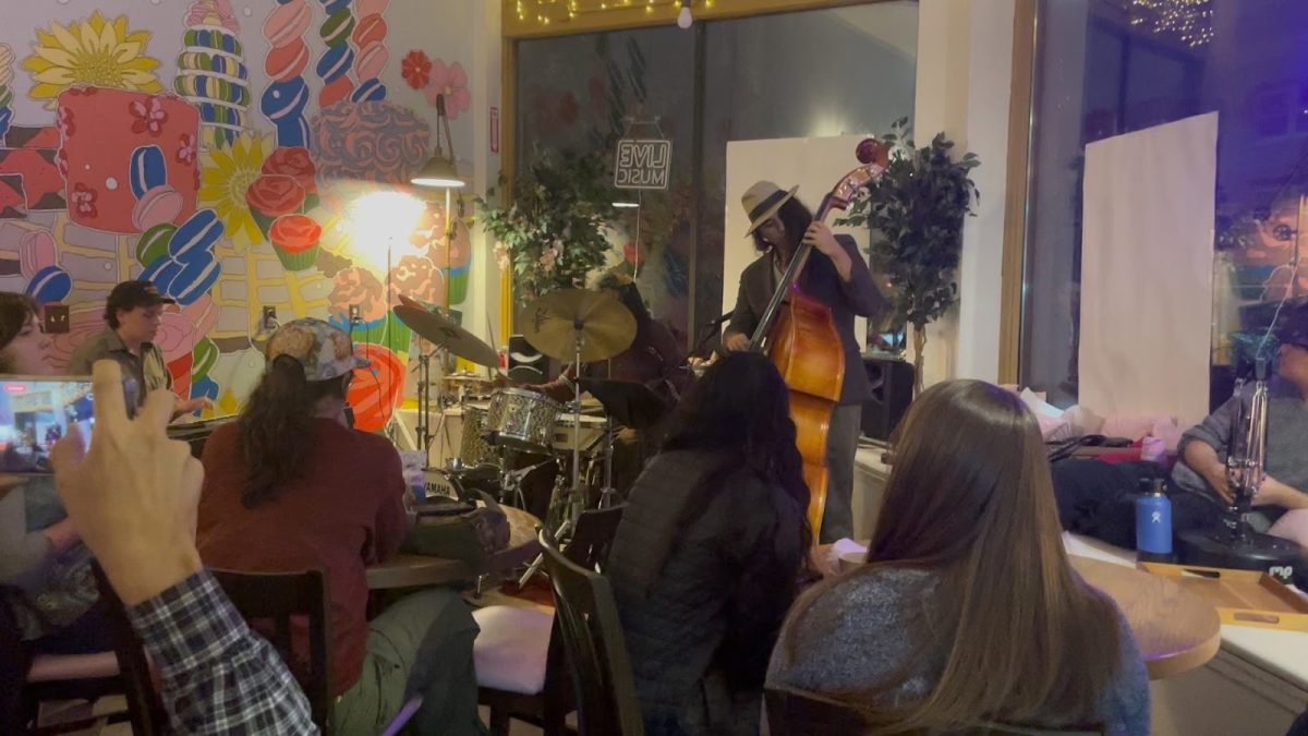 An audience watches jazz musicians at Farina Bakery. Farina Bakery hosts ‘Cake and Jazz’ nights multiple times a week, hosting local and traveling jazz musicians, and contributing to the spreading influence of jazz throughout Portland.
