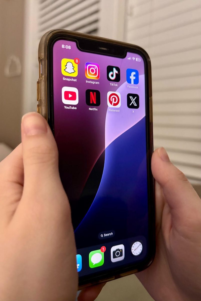A phone screen filled with social media apps. Short-form content has surged in popularity in the past decade and transformed the way society consumes media.