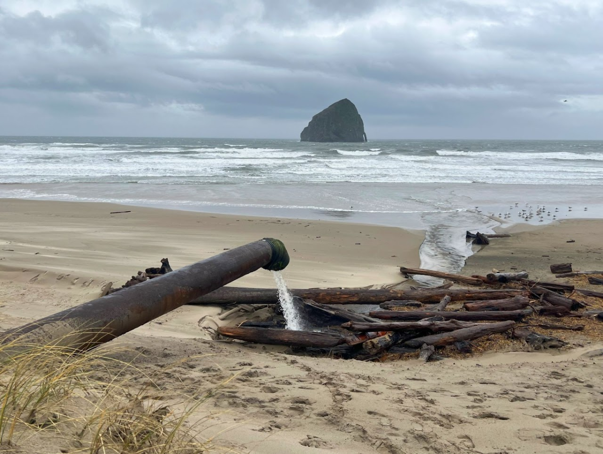 A pipe on Cannon Beach drains stormwater runoff into the Pacific Ocean. The omnipresence of microplastics in our oceans has a damaging impact on marine life and, consequently, on human health. Photo via Oregon Microplastics Analytical Research Center (OMARC).