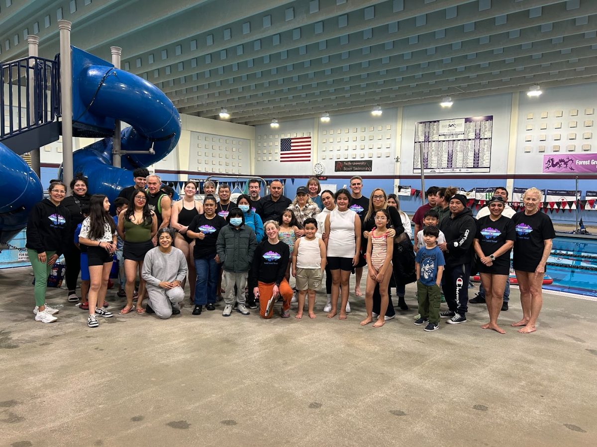 WaterStrong volunteers and participants at the Forest Grove City Aquatic Center. This is one of the many spaces used for Eco-Swim Clinics and other Waterstrong events that help educate families about water safety and environmental awareness. Photo by Eleanor Harper.