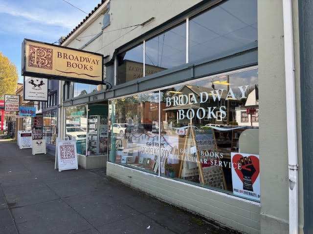 The exterior of neighborhood bookstore Broadway Books. Located on NE Broadway, Broadway Books is one of the numerous local bookstores in Portland that provide the community with curated selections tailored to neighborhood interests. 
Photo via Kim Bissell.