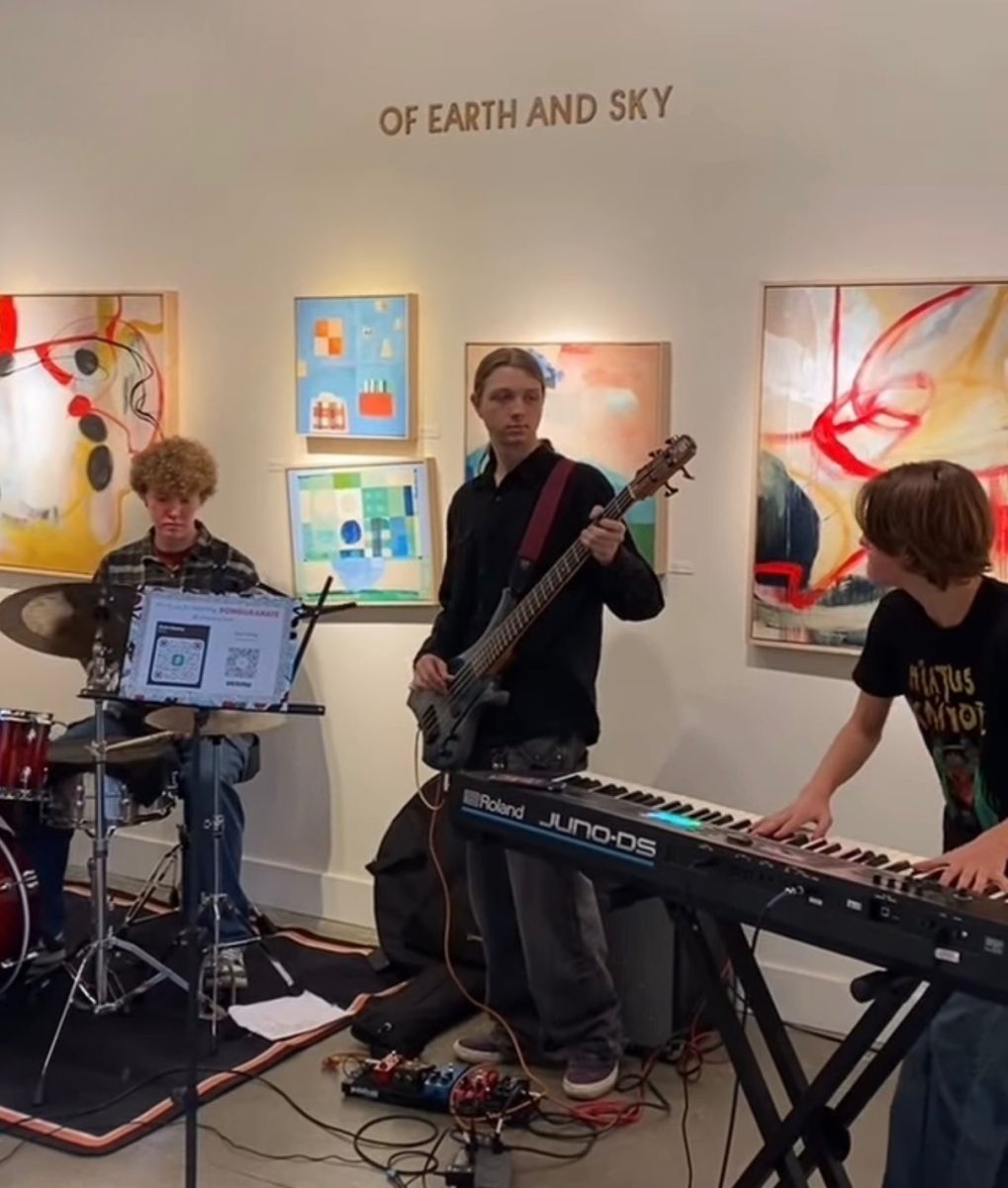 Pomegranate playing at Waterstone Gallery. The band aspires to play at as many local venues as they can throughout Portland, making their sound known to the community. Photo via Pomegranate.