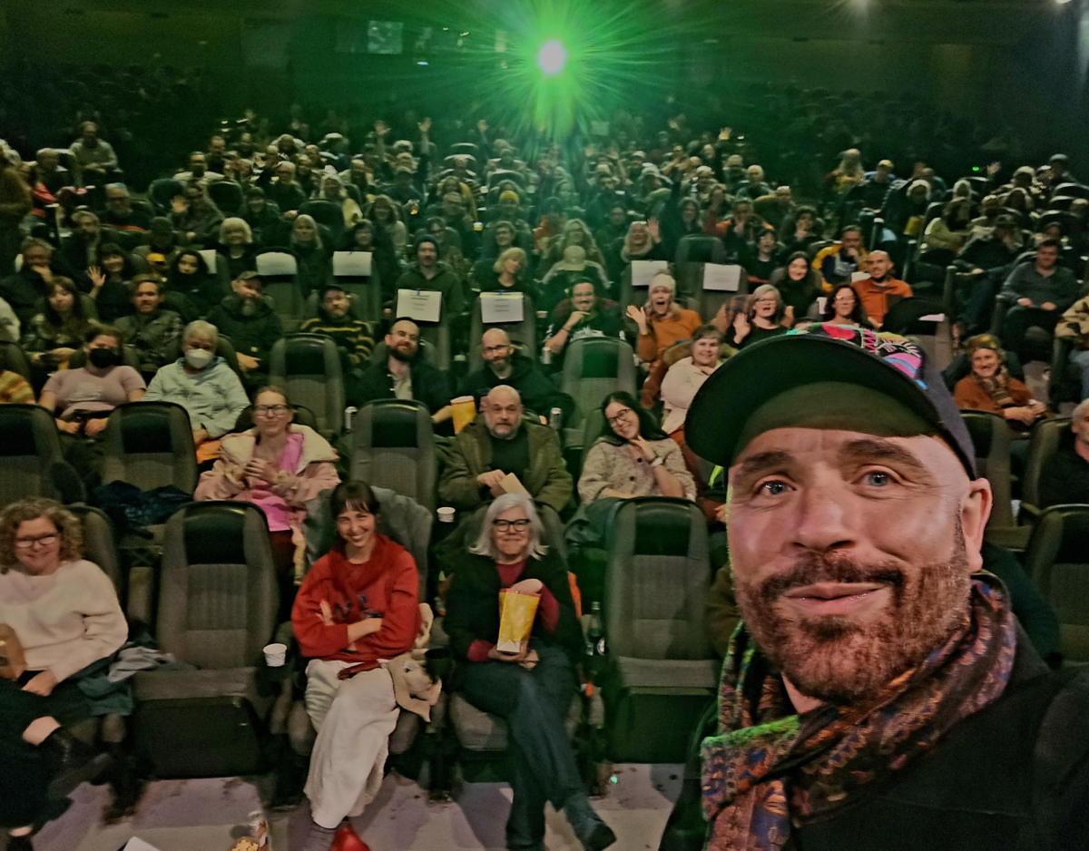 Rozzell Medina, director and programmer of the Portland EcoFilm Festival, poses for a selfie at the Opening Night 2026 special performance. Based at the Hollywood Theatre, the festival is a celebration of ecological films that takes place annually from March to June. Photo by Rozell Medina.
