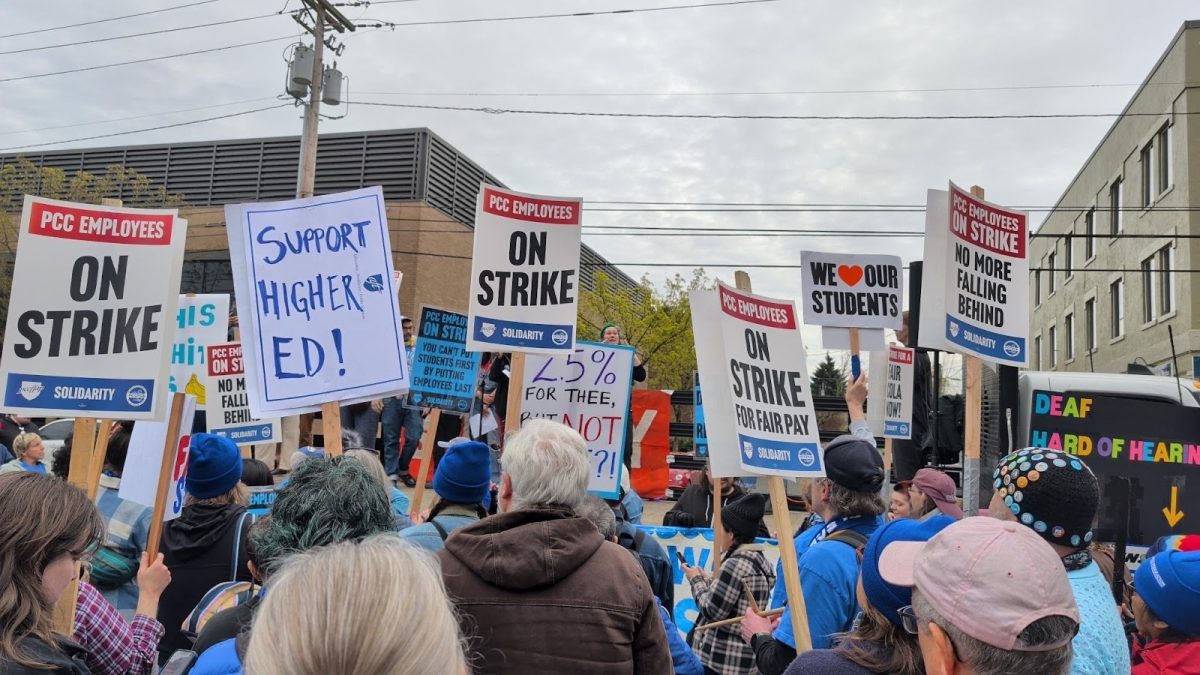 Picketers on strike outside of a Portland Community College (PCC) campus. PCC faculty went on strike for nearly three weeks to advocate for better contracts, and, during this strike, held pickets at all of the PCC campuses. Photo via Alan Cordle.