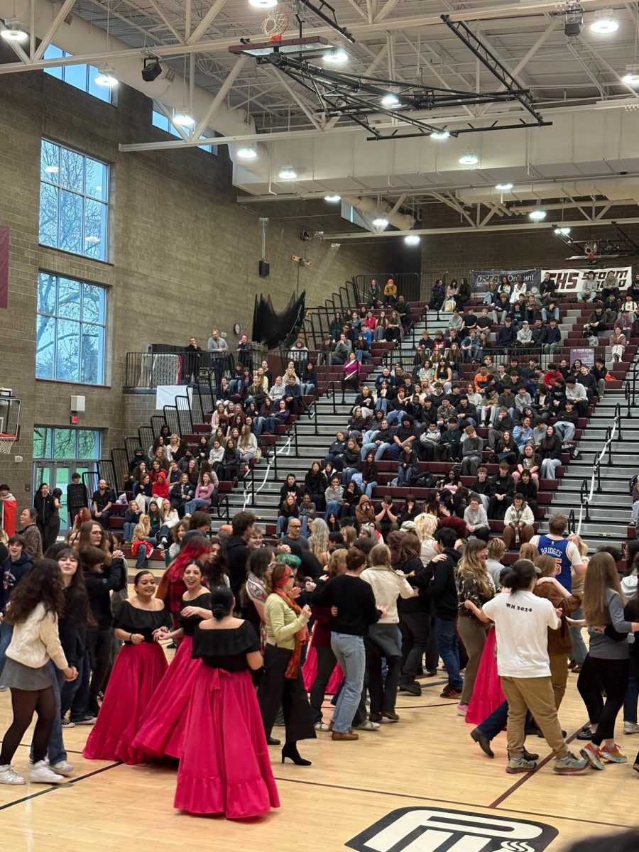 Franklin volunteers perform an owl partner dance. This dance was one of the few performed at this year's BIPOC Assembly. Photo by Sofie Salewsky.