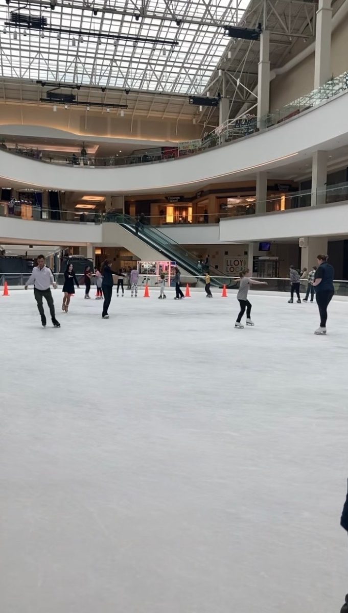 A free skate session at Lloyd Center Ice Rink. Open skate sessions are an easy way for people to immerse themselves in ice skating without committing to taking a formal lesson. Photo by Charity Fain.